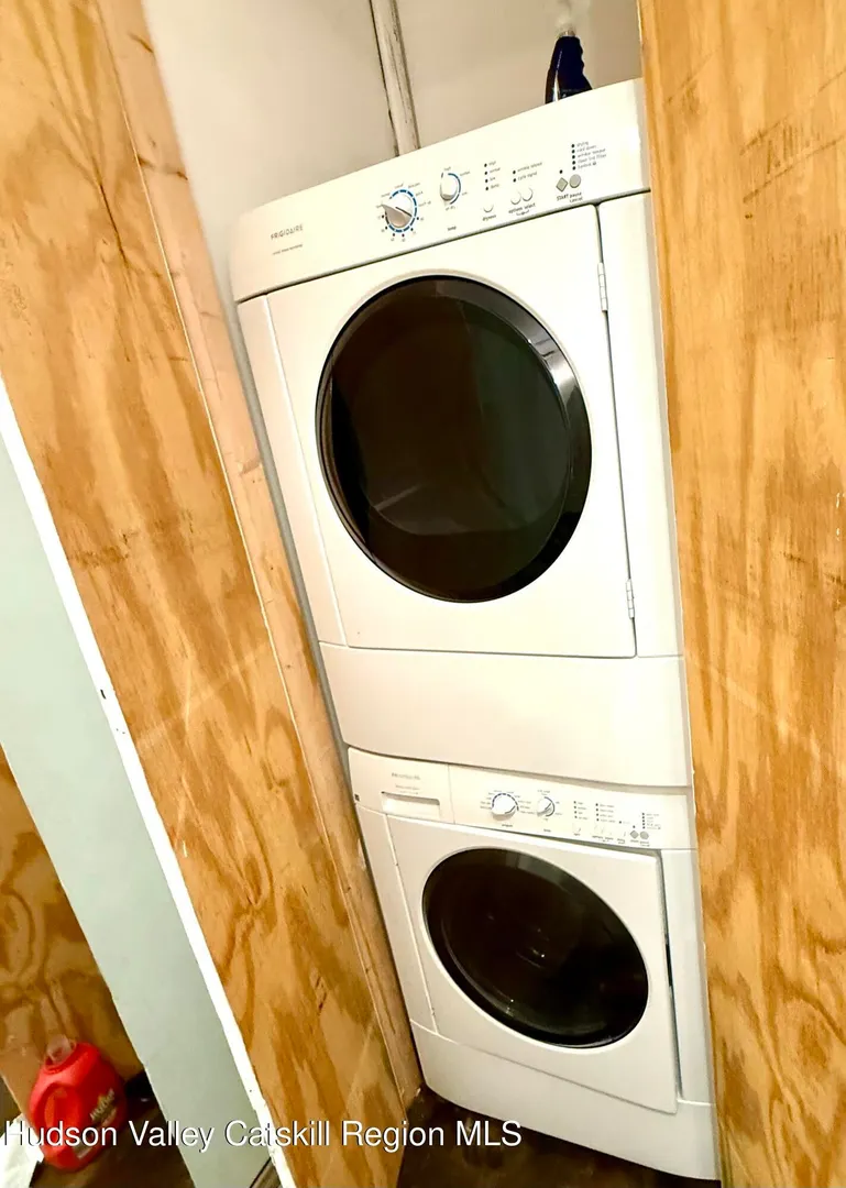 Stacked washer and dryer in a residential unit