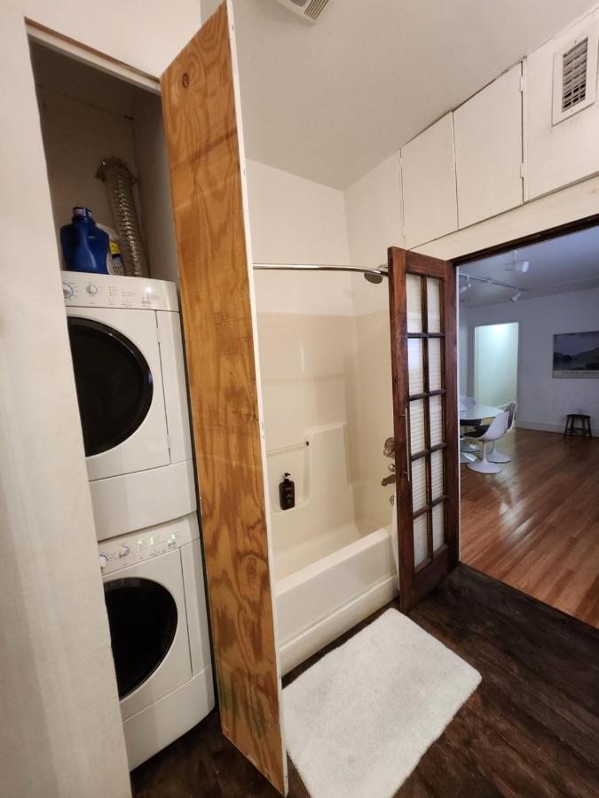 Apartment laundry and tiled tub area