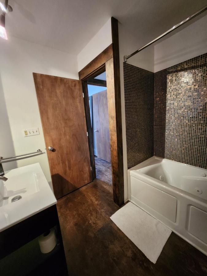 Apartment bathroom with tiled tub